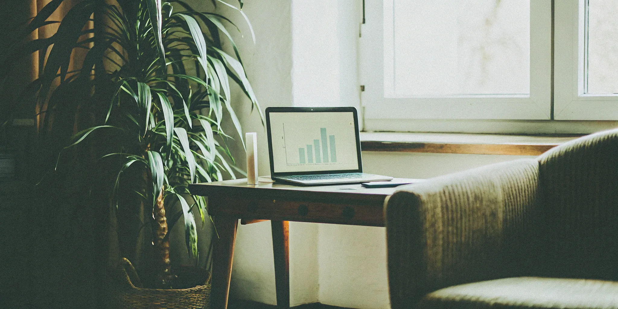 Laptop with a graph showing financial data for factoring home care Medicaid receivables.