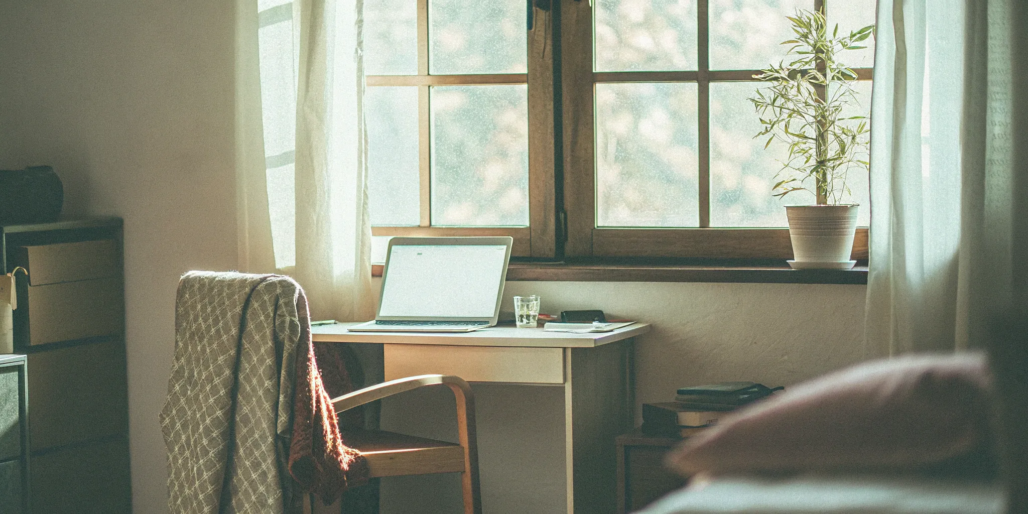 Laptop on a desk displaying electronic timesheets for home care.